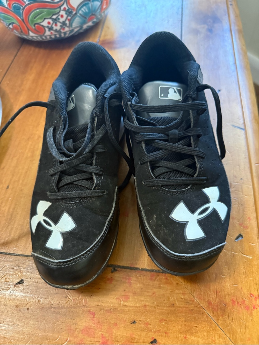 Youth Under Armour Black Sneakers baseball cleats.